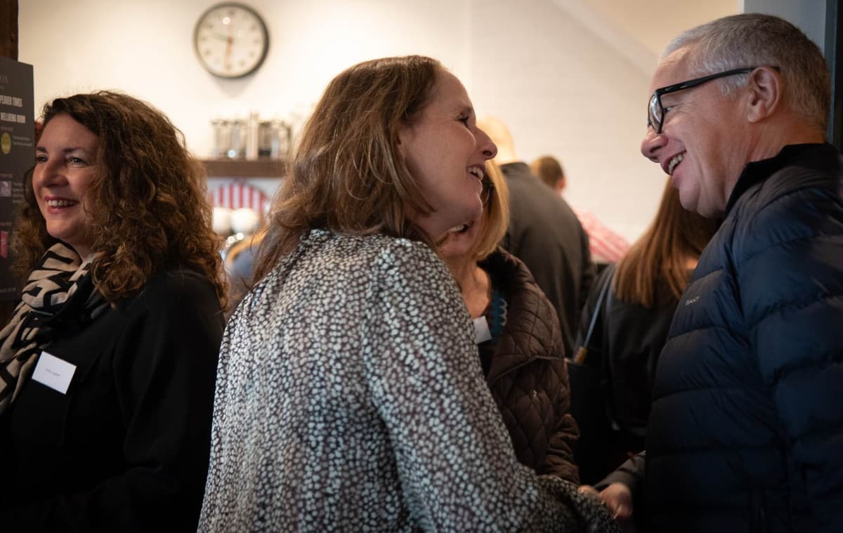People laughing and connecting at Hinton Workspace